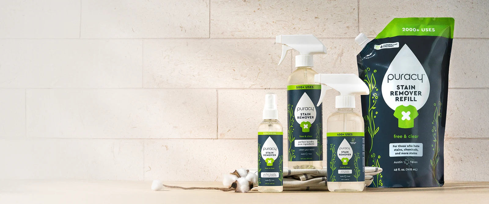 Puracy stain-fighting laundry products arranged across a lifestyle hero banner